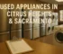 Row of clean used refrigerators, washers, and dryers in a Citrus Heights appliance store showroom
