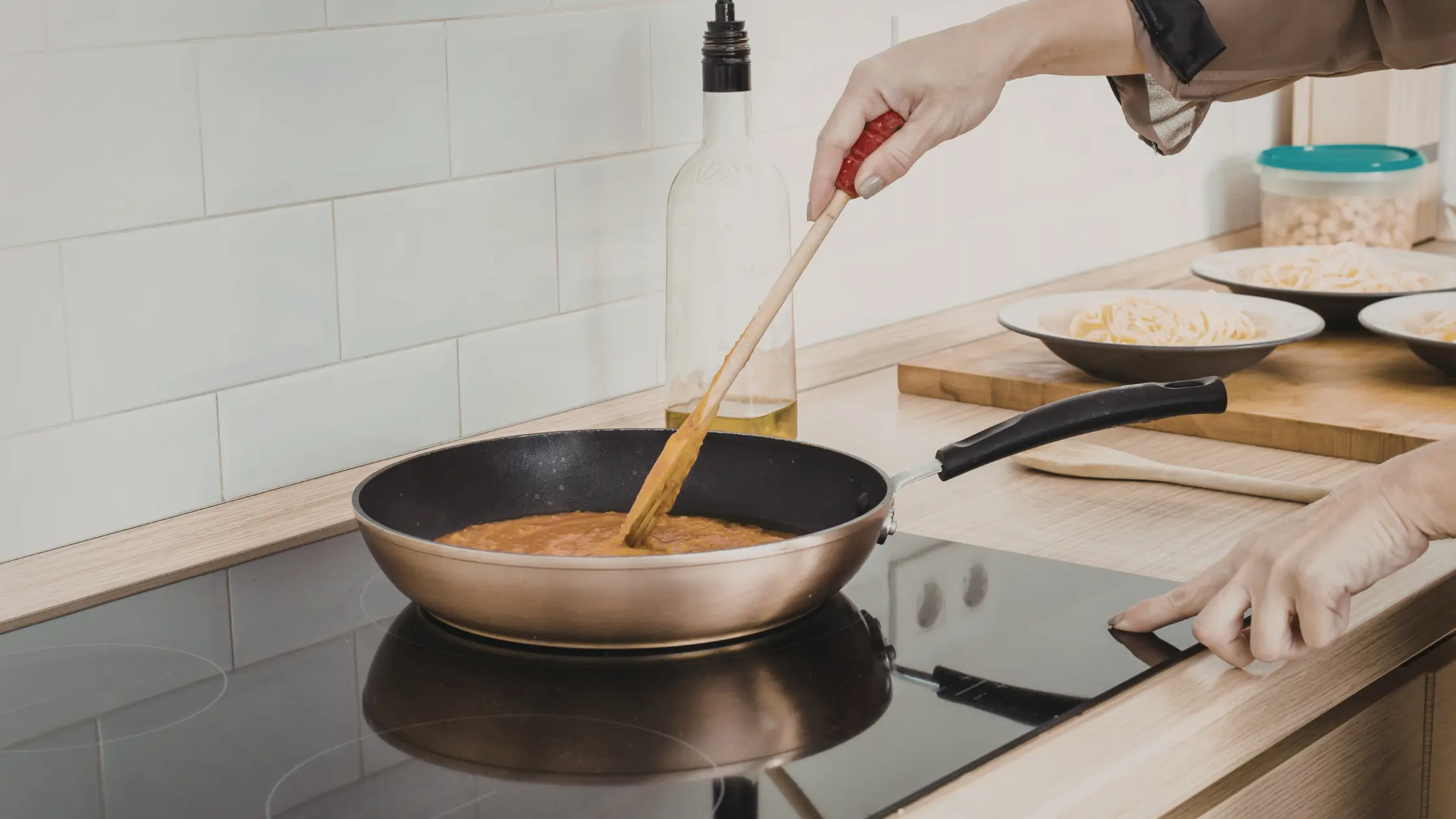 A person is cooking on Induction cooktop