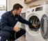 City Appliance Store technician inspecting a used electric dryers before purchase in a Citrus Heights home laundry room.