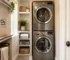 Stackable front load washer and dryer in a small laundry room with City Appliances branding, ideal for Citrus Heights homes.