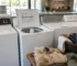 Used top-load agitator washers at City Appliances in Citrus Heights with heavily soiled work clothes ready for washing.