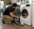 Used electric dryers in Sacramento showroom with City Appliances technician inspecting dryer drum, lint filter, and condition before purchase